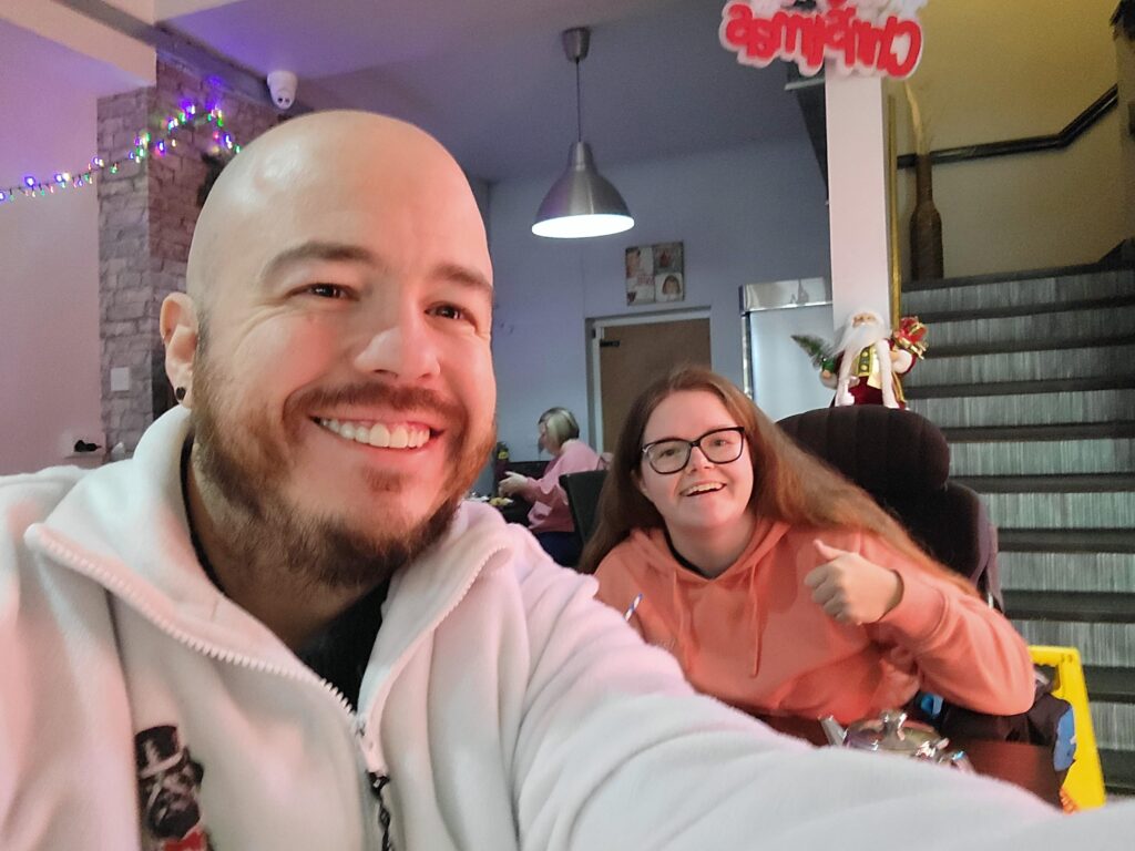 Claire and Marty taking a selfie at a coffee meeting